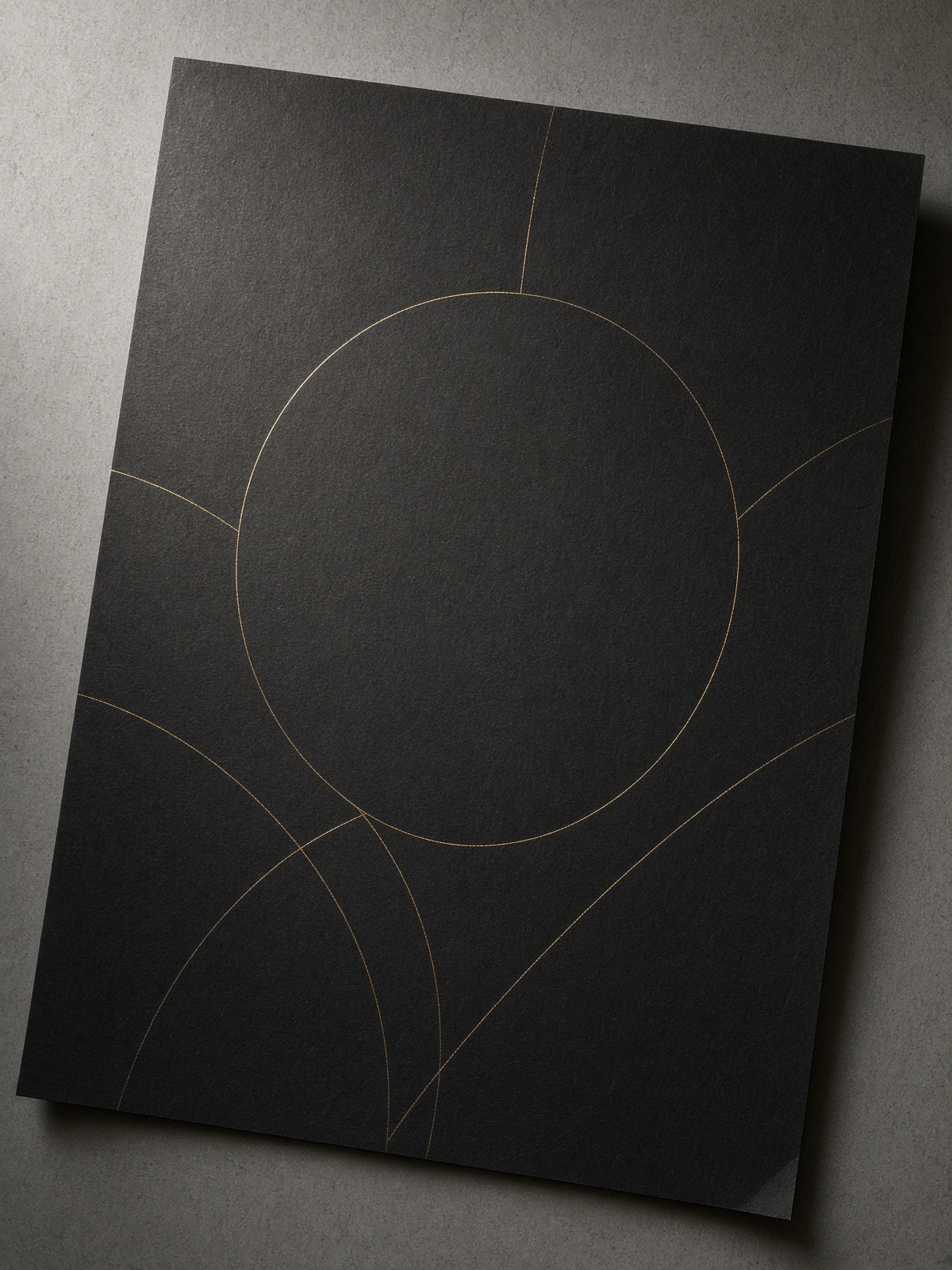 Dark paper crossed by thin brass arcs and one circle.